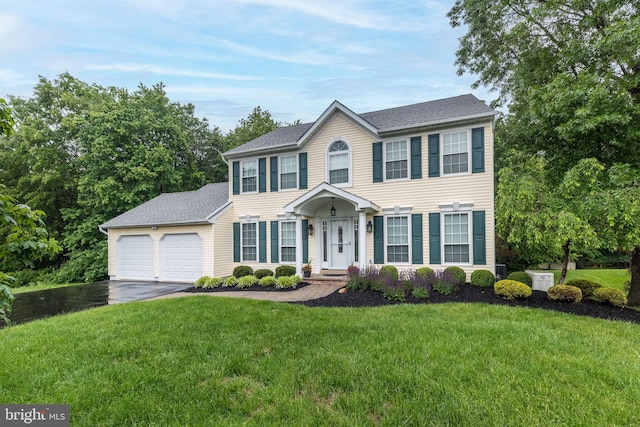 256 Rock Run Rd, Yardley, PA 19067 - colonial inspired home with an attached garage, asphalt driveway, a front lawn, and a shingled roof