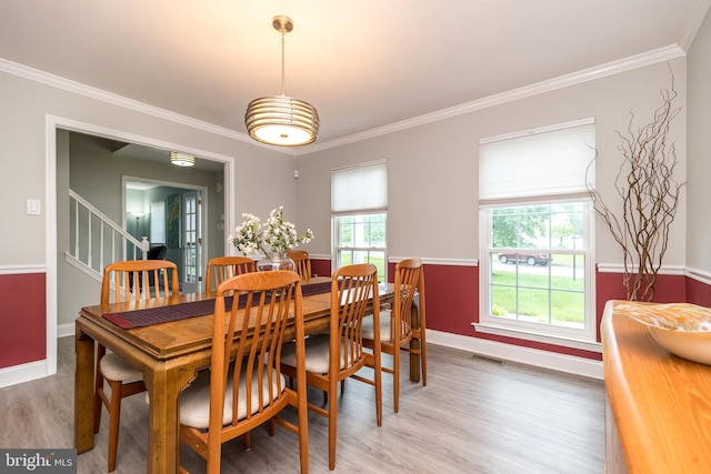 256 Rock Run Rd, Yardley, PA 19067 - dining room featuring crown molding, light wood-style flooring, baseboards, and stairway