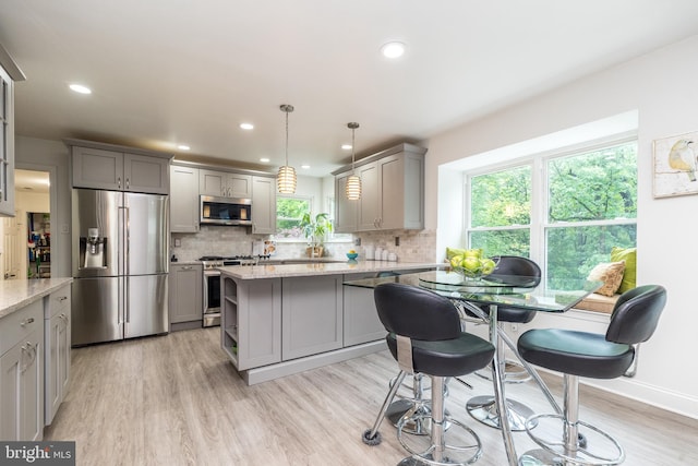 256 Rock Run Rd, Yardley, PA 19067 - kitchen with appliances with stainless steel finishes, gray cabinetry, decorative backsplash, plenty of natural light, and recessed lighting