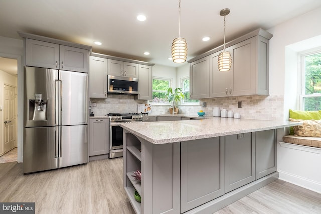 256 Rock Run Rd, Yardley, PA 19067 - kitchen with stainless steel appliances, gray cabinetry, open shelves, a peninsula, and healthy amount of natural light