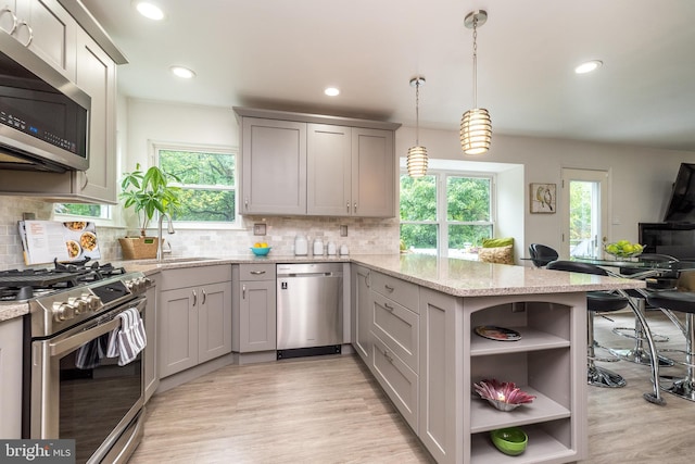 256 Rock Run Rd, Yardley, PA 19067 - kitchen with appliances with stainless steel finishes, a peninsula, healthy amount of natural light, open shelves, and recessed lighting
