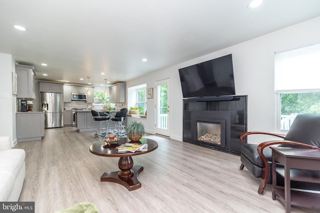256 Rock Run Rd, Yardley, PA 19067 - living room with light wood-style flooring, recessed lighting, and a tile fireplace