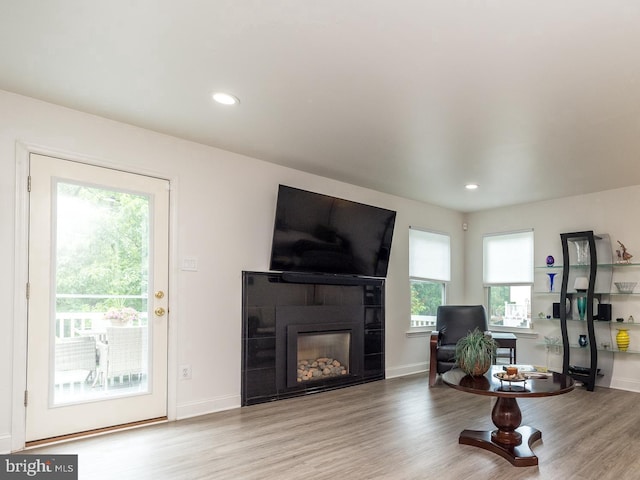256 Rock Run Rd, Yardley, PA 19067 - living room with a glass covered fireplace, wood finished floors, recessed lighting, baseboards, and a desk
