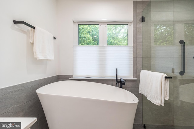 256 Rock Run Rd, Yardley, PA 19067 - full bath with tile walls, a soaking tub, and a tile shower