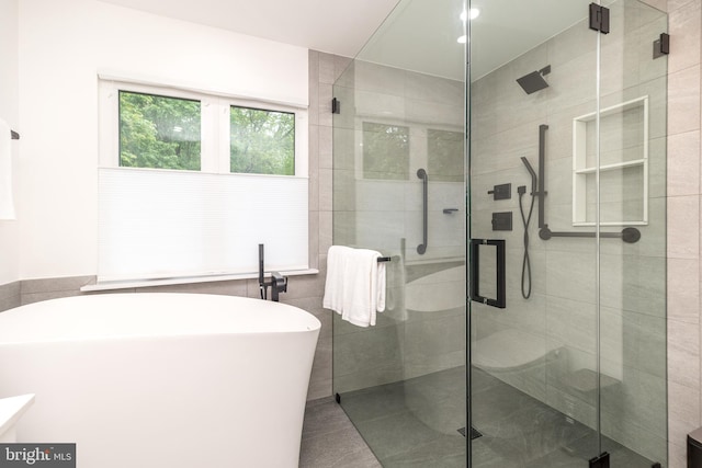 256 Rock Run Rd, Yardley, PA 19067 - full bathroom featuring a soaking tub, a shower stall, tile patterned floors, and vanity