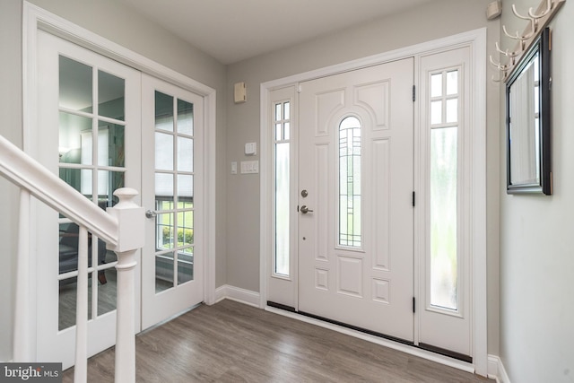 256 Rock Run Rd, Yardley, PA 19067 - entrance foyer featuring baseboards, wood finished floors, and stairway