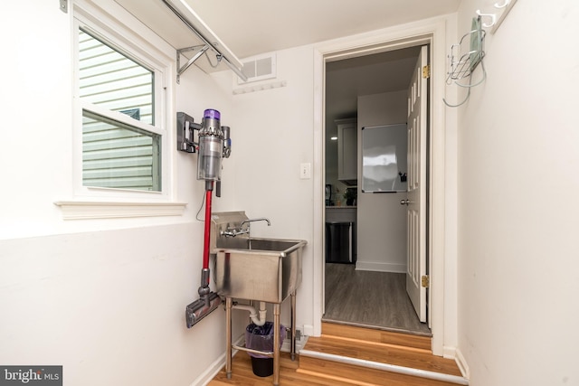 256 Rock Run Rd, Yardley, PA 19067 - corridor with wood finished floors, a sink, and baseboards