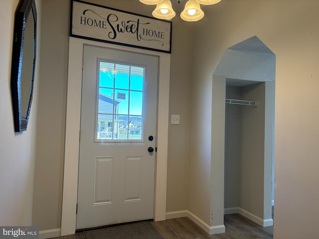 203 4th Ave, Burnham, PA 17009 - entryway featuring a chandelier, dark wood-type flooring, and baseboards