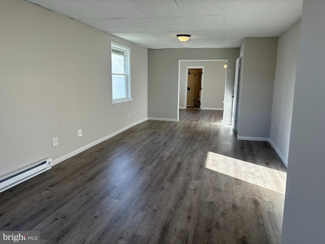 203 4th Ave, Burnham, PA 17009 - spare room with a drop ceiling, dark wood finished floors, baseboards, and baseboard heating