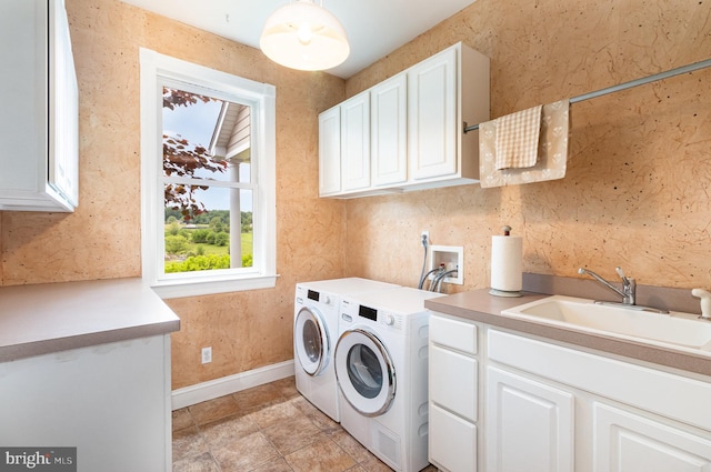 148 Lawn Rd, Palmyra, PA 17078 - laundry area with cabinet space, washer and clothes dryer, and baseboards