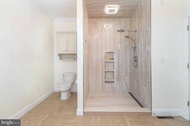 148 Lawn Rd, Palmyra, PA 17078 - bathroom featuring tiled shower, toilet, ornamental molding, tile patterned flooring, and baseboards