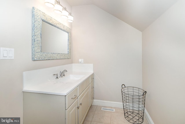 148 Lawn Rd, Palmyra, PA 17078 - bathroom featuring vanity, baseboards, lofted ceiling, and tile patterned flooring