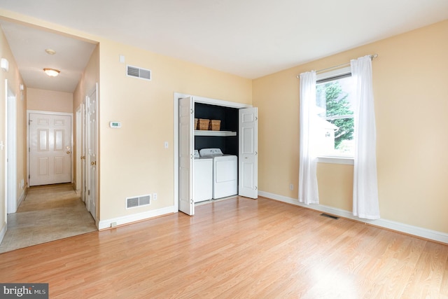 148 Lawn Rd, Palmyra, PA 17078 - unfurnished bedroom with washing machine and clothes dryer, light wood-type flooring, and baseboards