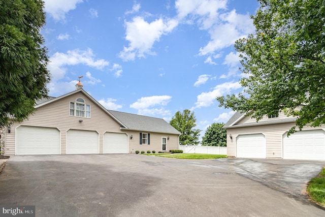 148 Lawn Rd, Palmyra, PA 17078 - view of front facade featuring a garage and asphalt driveway