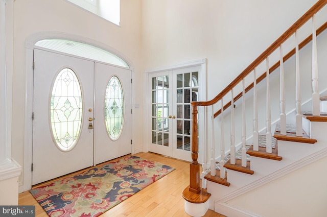 148 Lawn Rd, Palmyra, PA 17078 - entrance foyer featuring french doors, plenty of natural light, stairs, wood finished floors, and a towering ceiling
