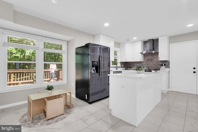 14901 Running Ridge Ln, Silver Spring, MD 20906 - kitchen with refrigerator with ice dispenser, wall chimney range hood, light marble finish flooring, white cabinets, and light countertops
