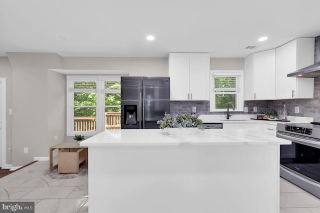 14901 Running Ridge Ln, Silver Spring, MD 20906 - kitchen with stainless steel appliances, a sink, backsplash, white cabinets, and recessed lighting