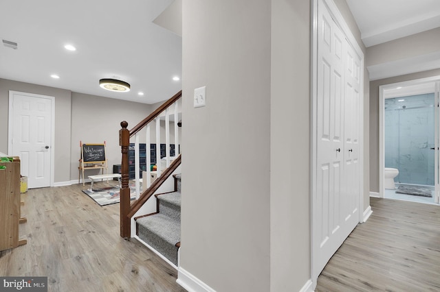 14901 Running Ridge Ln, Silver Spring, MD 20906 - staircase with recessed lighting, wood finished floors, and baseboards