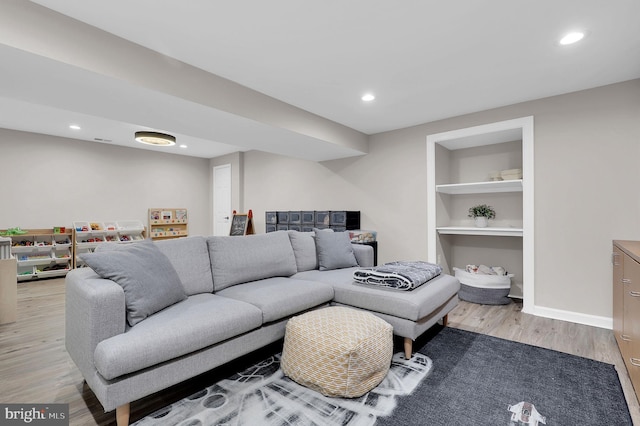 14901 Running Ridge Ln, Silver Spring, MD 20906 - living area featuring wood finished floors, built in shelves, recessed lighting, and baseboards
