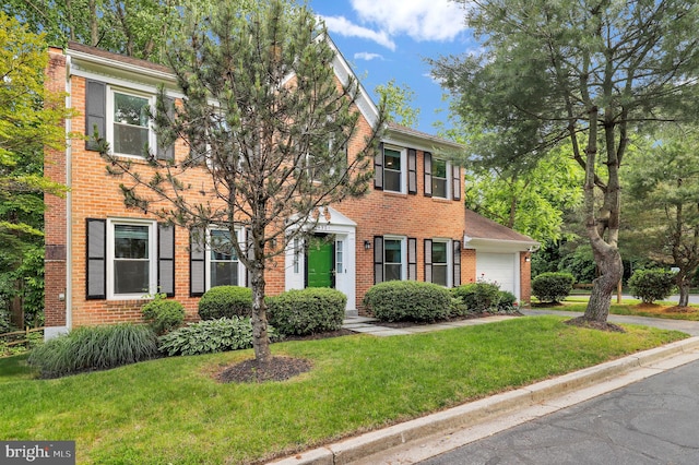 14901 Running Ridge Ln, Silver Spring, MD 20906 - colonial home featuring brick siding, a garage, and a front yard