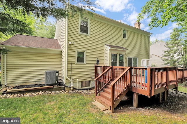 14901 Running Ridge Ln, Silver Spring, MD 20906 - back of house with a chimney, a deck, a yard, and central AC