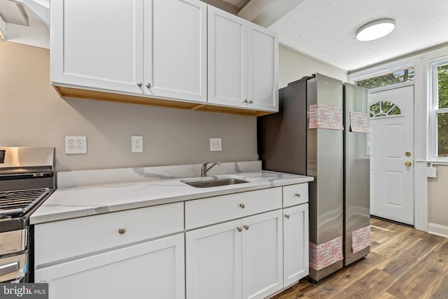 616 Hamilton St NW, Washington, DC 20011 - kitchen with a sink, wood finished floors, custom exhaust hood, and white cabinetry