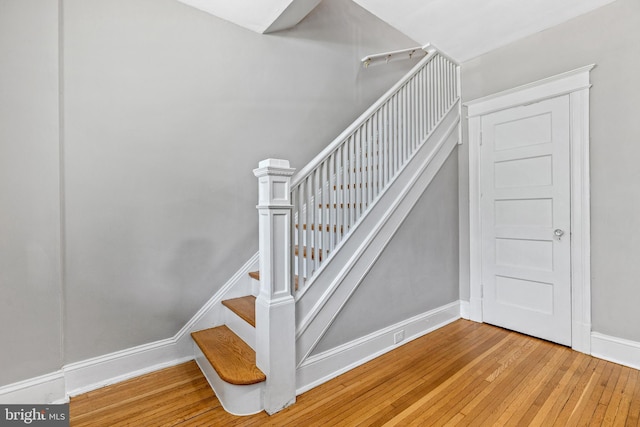 616 Hamilton St NW, Washington, DC 20011 - stairs featuring wood-type flooring and baseboards