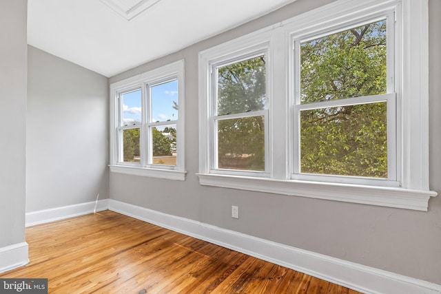 616 Hamilton St NW, Washington, DC 20011 - spare room featuring plenty of natural light, baseboards, light wood-type flooring, and lofted ceiling