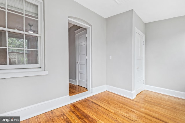 616 Hamilton St NW, Washington, DC 20011 - unfurnished room with baseboards, wood finished floors, and arched walkways
