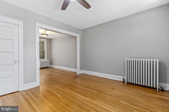 616 Hamilton St NW, Washington, DC 20011 - spare room with radiator heating unit, ceiling fan, light wood-type flooring, and baseboards