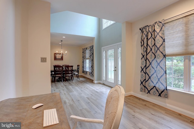 6224 Parkview Ct, Elkridge, MD 21075 - entryway featuring light wood-style flooring, healthy amount of natural light, a chandelier, and a towering ceiling