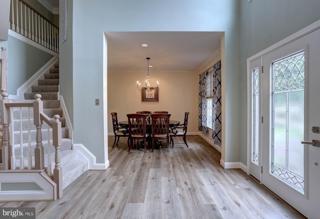 6224 Parkview Ct, Elkridge, MD 21075 - foyer entrance featuring stairway, wood finished floors, a chandelier, crown molding, and baseboards