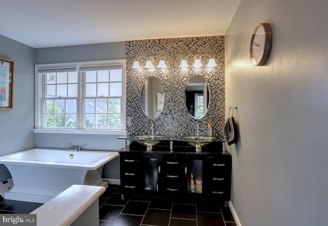6224 Parkview Ct, Elkridge, MD 21075 - bathroom with a freestanding tub, double vanity, baseboards, tile patterned floors, and tasteful backsplash