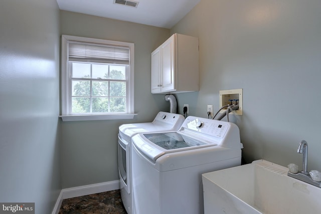 6224 Parkview Ct, Elkridge, MD 21075 - laundry room with cabinet space, baseboards, washer and dryer, and dark stone finish flooring