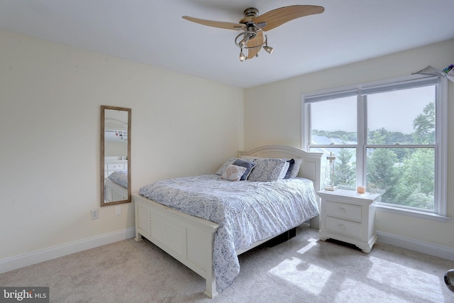 6224 Parkview Ct, Elkridge, MD 21075 - bedroom featuring multiple windows, baseboards, and light carpet
