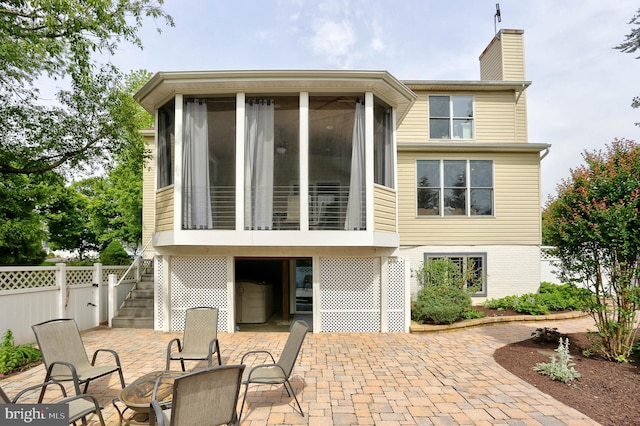6224 Parkview Ct, Elkridge, MD 21075 - back of property with stairway, a sunroom, a patio area, a chimney, and an outdoor fire pit