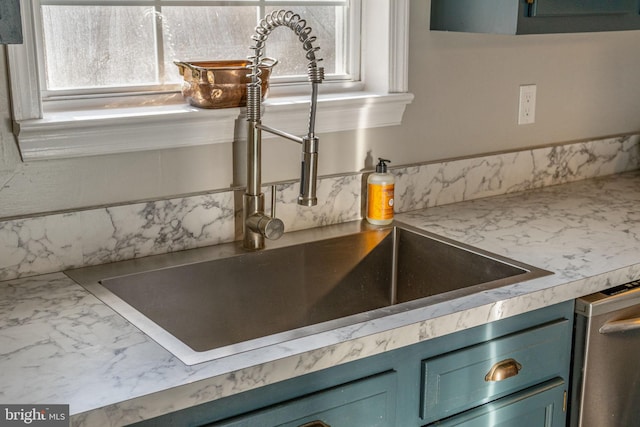 19446 Heather Ln, Orange, VA 22960 - kitchen view of a sink, blue cabinetry, light countertops, and dishwasher
