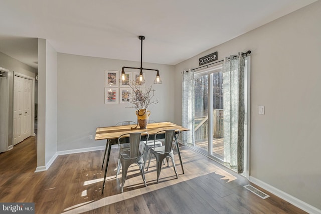 19446 Heather Ln, Orange, VA 22960 - dining space with baseboards, wood finished floors, and a chandelier