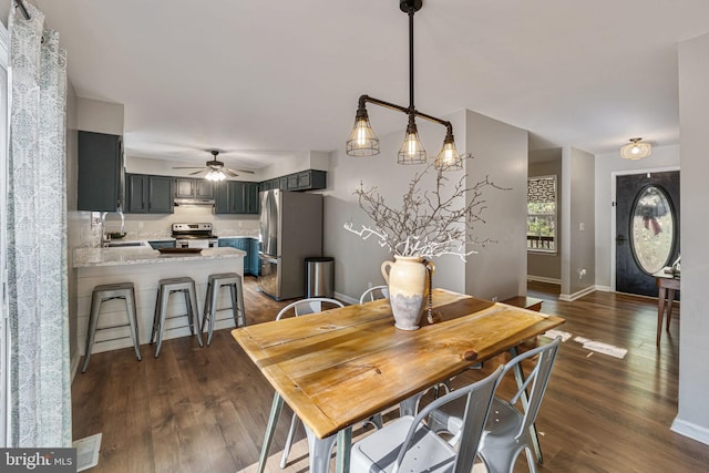 19446 Heather Ln, Orange, VA 22960 - dining room featuring dark wood finished floors, a ceiling fan, and baseboards