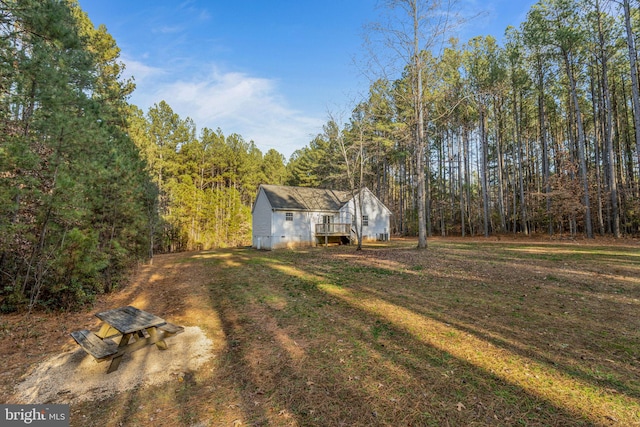 19446 Heather Ln, Orange, VA 22960 - view of green lawn featuring a wooded view and a wooden deck