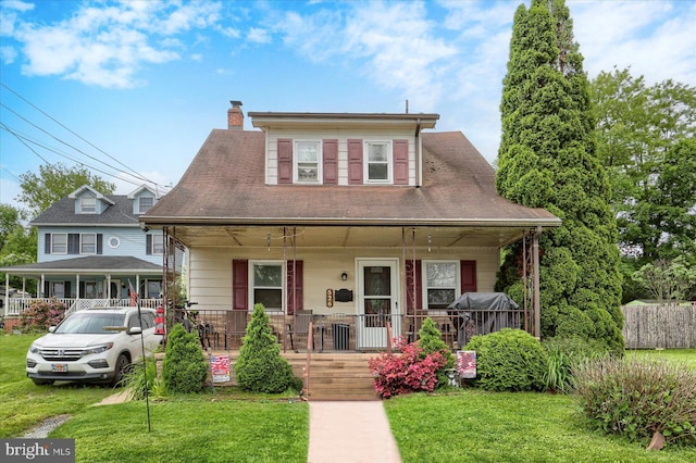526 N 3rd St, Wormleysburg, PA 17043 - bungalow with covered porch, a front lawn, and a chimney