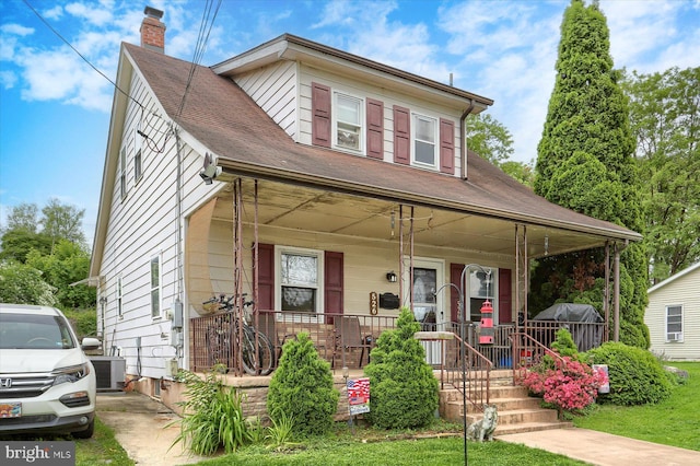 526 N 3rd St, Wormleysburg, PA 17043 - view of front of house with covered porch, a chimney, central AC unit, and a shingled roof