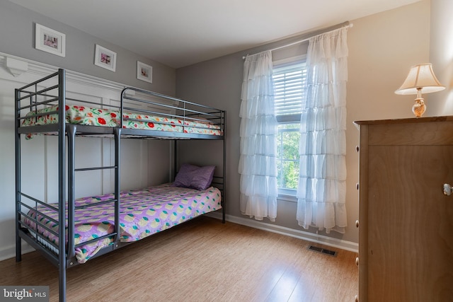 21008 Strawrick Ter, Ashburn, VA 20147 - bedroom featuring wood finished floors, multiple windows, and baseboards