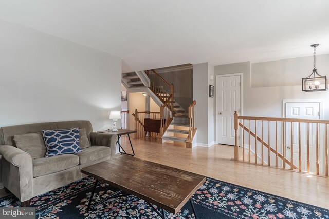21008 Strawrick Ter, Ashburn, VA 20147 - living area featuring wood finished floors and baseboards