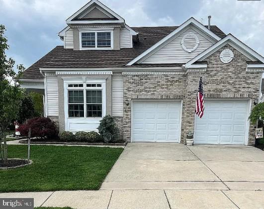 83 Brigantine Blvd, Waretown, NJ 08758 - traditional-style house featuring driveway, a front lawn, a garage, and a shingled roof