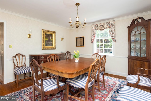 114 Bellemore Rd, Baltimore, MD 21210 - dining area featuring a chandelier, crown molding, wood finished floors, and baseboards