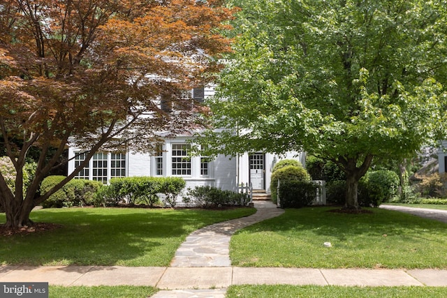 114 Bellemore Rd, Baltimore, MD 21210 - view of property hidden behind natural elements featuring a front lawn