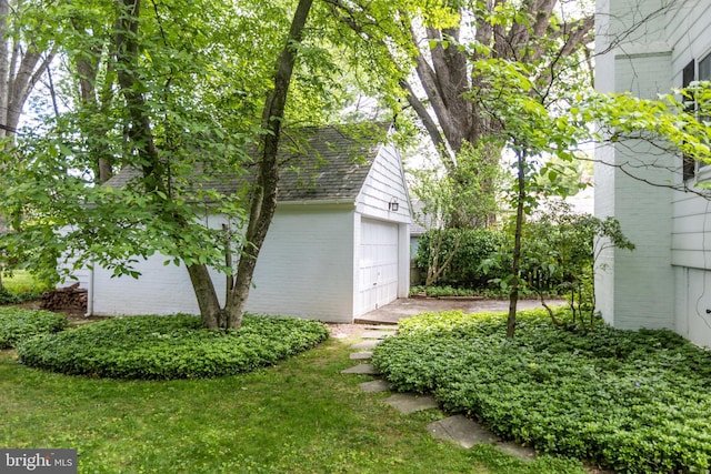 114 Bellemore Rd, Baltimore, MD 21210 - view of yard featuring a garage and an outbuilding