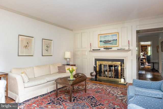 114 Bellemore Rd, Baltimore, MD 21210 - living area with ornamental molding, wood finished floors, and a glass covered fireplace