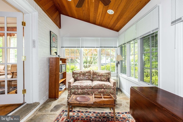 114 Bellemore Rd, Baltimore, MD 21210 - sunroom / solarium with wood ceiling, healthy amount of natural light, stone finish flooring, vaulted ceiling, and brick wall